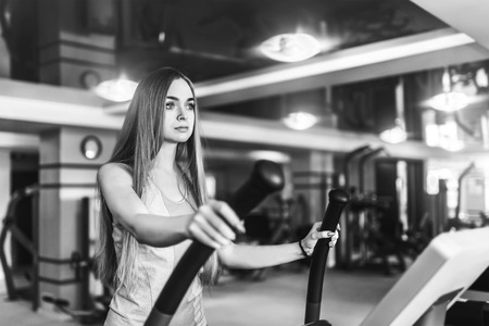 Pretty sporty girl training in the gymの写真素材