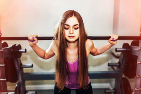 Pretty sporty girl training in the gymの写真素材