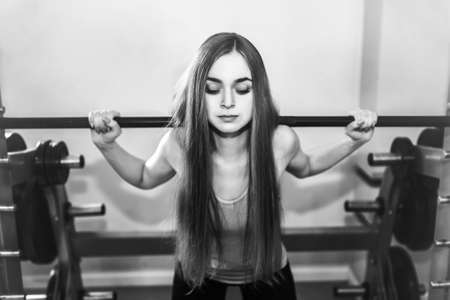 Pretty sporty girl training in the gymの写真素材