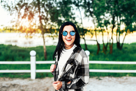 Pretty brunette girl have fun outdoor in the parkの写真素材