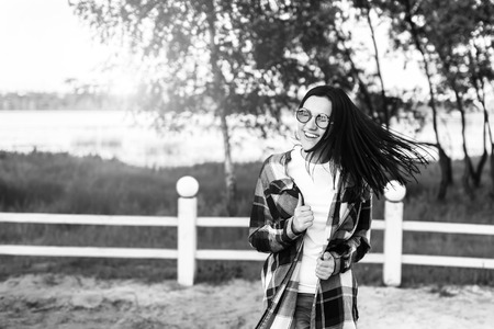 Pretty brunette girl have fun outdoor in the parkの写真素材