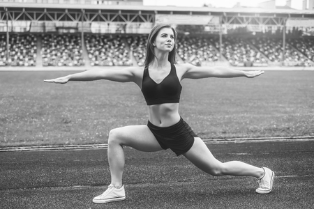 Pretty young brunette sporty girl workout outdoor, black and whiteの写真素材