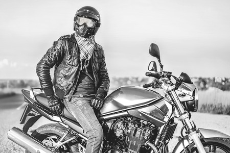 Biker on sport motorcycle outdoor on the roadの写真素材