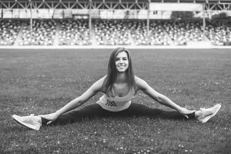 Pretty young brunette sporty girl workout outdoor, black and whiteの写真素材