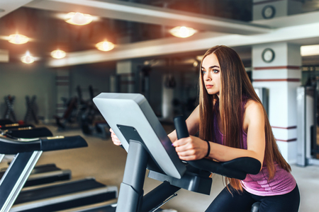 Pretty sporty girl training in the gymの写真素材