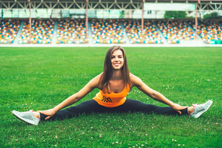 Pretty young brunette sporty girl workout outdoorの写真素材