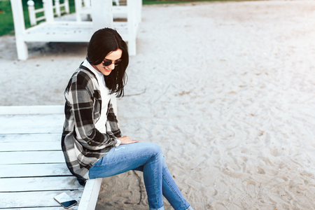 Young brunette girl relaxing outdoor in the parkの写真素材