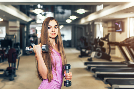 Pretty sporty girl training in the gymの写真素材
