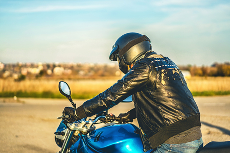 Biker on sport motorcycle outdoor on the roadの写真素材