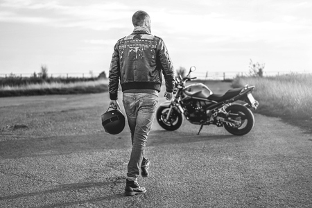 Biker on sport motorcycle outdoor on the roadの写真素材