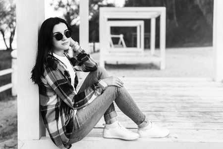 Young brunette girl relaxing outdoor in the parkの写真素材