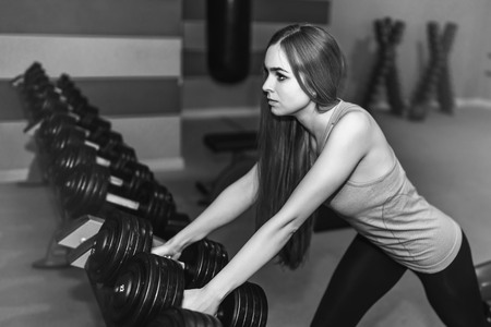 Pretty sporty girl training in the gymの写真素材