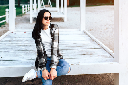 Young brunette girl relaxing outdoor in the parkの写真素材