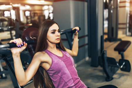 Pretty sporty girl training in the gymの写真素材