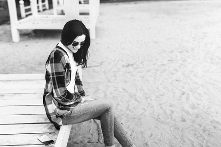 Young brunette girl relaxing outdoor in the parkの写真素材