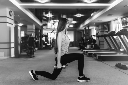 Pretty sporty girl training in the gymの写真素材