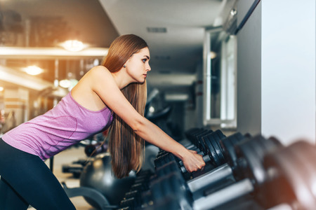 Pretty sporty girl training in the gymの写真素材