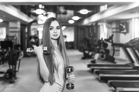 Pretty sporty girl training in the gymの写真素材