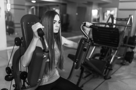 Pretty sporty girl training in the gymの写真素材