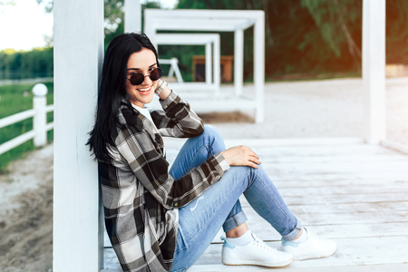 Young brunette girl relaxing outdoor in the parkの写真素材