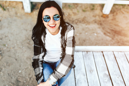 Young brunette girl relaxing outdoor in the parkの写真素材