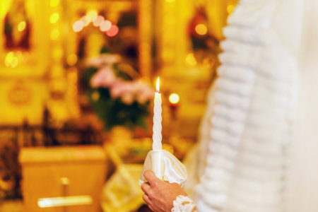 Wedding ceremony in church with candle in hands