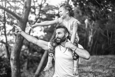 Father with his daughter have fun outdoorの写真素材