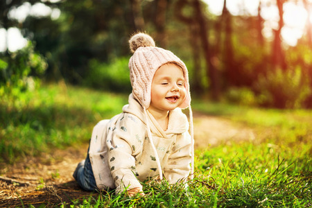Cute little baby girl playing outdoorの写真素材