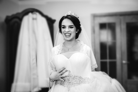 Beautiful bride dressing up before wedding ceremonyの写真素材