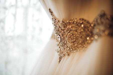 Beautiful wedding dress hang in the brideâs roomの写真素材
