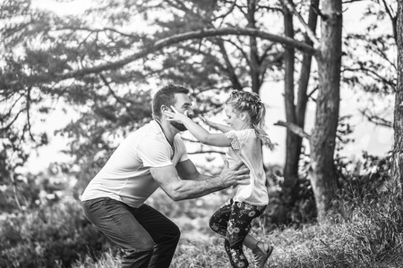 Father with his daughter have fun outdoorの写真素材