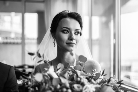 Beautiful bride with bouquet of flowersの写真素材