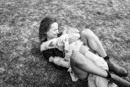 Mother with her little daughter have fun outdoorの写真素材