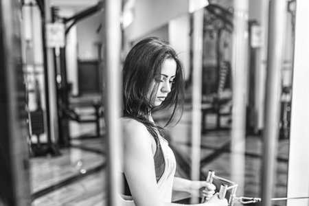 Pretty sporty girl workout in the gym
