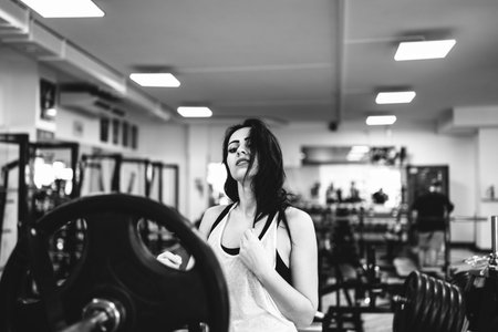 Pretty sporty girl workout in the gym