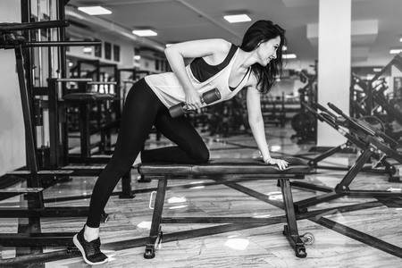 Pretty sporty girl workout in the gymの写真素材