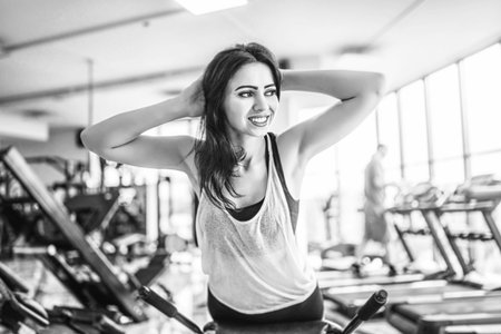 Pretty sporty girl workout in the gym