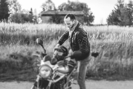 Biker on sport motorcycle outdoor on the road