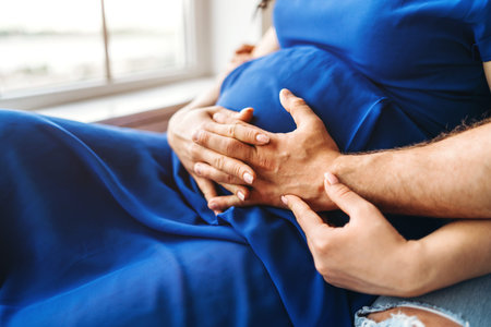 Pretty pregnant woman hug with her husband
