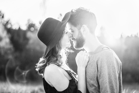 Pretty young romantic couple spend time together outdoorの写真素材