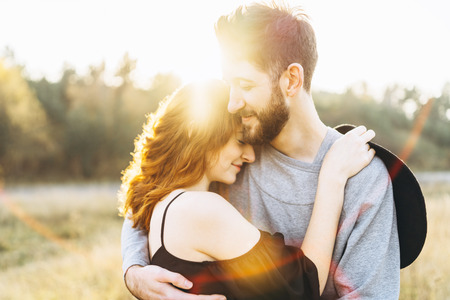 Pretty young romantic couple spend time together outdoorの写真素材