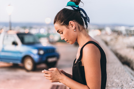 Pretty pan asian girl relaxing outdoor in the evening timeの写真素材