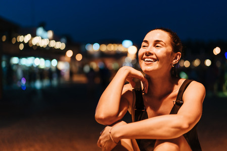 Pretty pan asian girl relaxing outdoor in the evening timeの写真素材