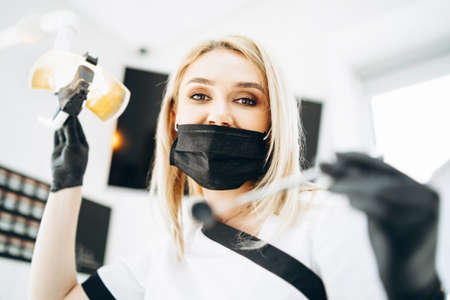 Portrait of the pretty young female dentist in a dental clinicの写真素材