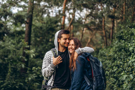 A tender loving couple walking in a field of currant. Man whirls woman in her arms. Love story.の写真素材