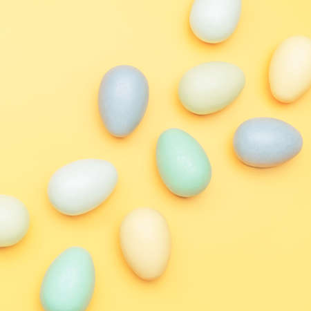 Creative flat lay photo of easter eggs on colorful backgroundの写真素材