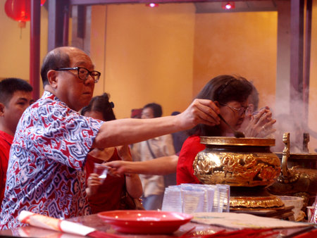Chinese people praying during Chinese New Year celebrationsのeditorial素材