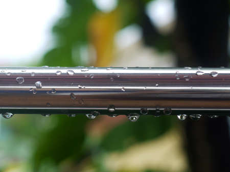 raindrops on the iron fenceの写真素材