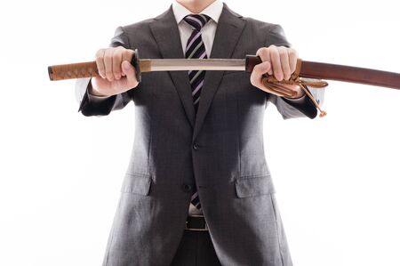Businessman suit that has a Japanese swordの写真素材