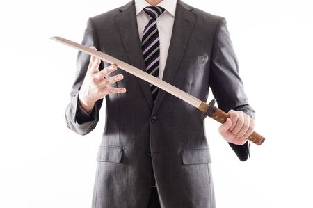 Businessman suit that has a Japanese swordの写真素材